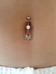 the belly ring is attached to a woman's stomach