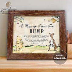 a winnie the pooh quote is displayed in a wooden frame on a shelf next to pencil