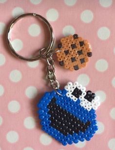 a keychain made to look like an animal with a pacman on it