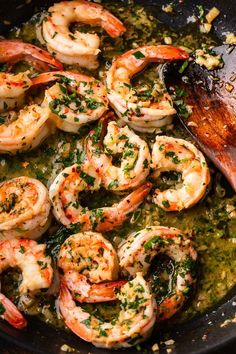 cooked shrimp with herbs and seasoning in a skillet