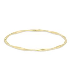 Graceful and elegant, this fashion bangle bracelet is a great day or evening wardrobe choice. Crafted in warm 14K gold, this polished design is gently twisted for a shimmering look. Wear two or more together for a bohemian chic look. Buffed to a bril Formal Yellow Gold Bangle With Modern Twist, Elegant 14k Gold Bangle With Diamond Cut, Elegant 14k Gold Diamond Cut Bangle, Elegant 14k Gold Flexible Bangle, Elegant 14k Gold Diamond-cut Bangle, Yellow Gold Flexible Bangle Bracelet, Flexible Yellow Gold Bangle, Flexible Yellow Gold Bangle Bracelets, Adjustable Yellow Gold Flexible Bangle