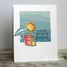 a close up of a card with a sun and beach scene on the back side