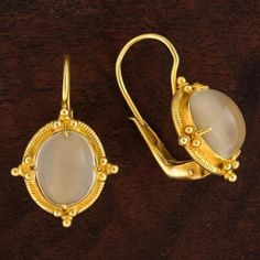 We can't guarantee that you won't fall in love with your own reflection, like Narcissus, in these luminous cabochon moonstone earrings. This Renaissance take on an ancient Greek design features a filigree and granule setting. 24k gold over sterling silver. European backs for pierced ears. Size: 1" tall. Victorian Moonstone Gold Jewelry, Victorian Gold Jewelry With Moonstone, Victorian Gold Moonstone Jewelry, Ancient Earrings, Ancient Greek Design, Lapis Earrings, Greek Design, Moonstone Earrings, Cubic Zirconia Earrings