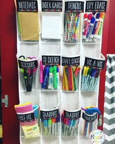 an organized closet with pens, pencils, markers and other office supplies on it