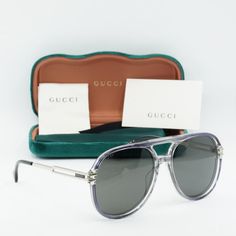 Transform your look with the sleek and stylish Gucci GG1104S 001 Transparent Grey/Silver/Grey aviator sunglasses from our exclusive collection at OSSA FRAMES.  Crafted with precision and elegance, these sunglasses are the perfect accessory for the modern man who values both fashion and function. The transparent grey metal frame exudes sophistication, while the grey lenses add a touch of mystery and allure.  With a lens socket width of 61 and temple length of 145, these sunglasses offer a comfortable and secure fit that is ideal for all-day wear. The bridge size of 16 ensures a perfect balance and stability on your face, while the aviator style adds a touch of classic charm to your outfit.  Designed by the iconic fashion house Gucci, these sunglasses are a true statement piece that will ele Gucci Glasses, Grey Sunglasses, Sunglasses Frame, Aviator Style, Men Eyeglasses, Metal Sunglasses, Grey Material, Rectangle Sunglasses, Gucci Black