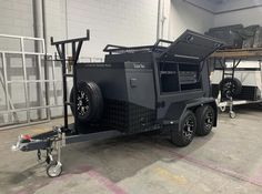 an utility trailer parked in a warehouse