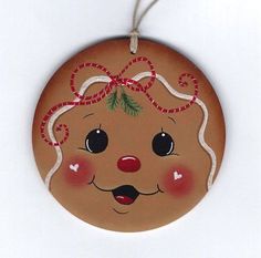 a ceramic ornament with a christmas decoration on it's face and nose