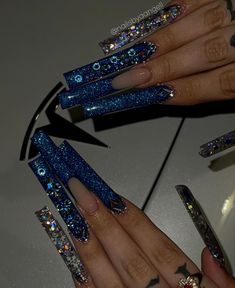 Blue Long Luxury Glitter Claws Icy Nails Acrylic, Blue And Silver Prom Nails Acrylic, Blue Long Nails, Black And Blue Long Nails, Blue Dramatic Nails, Blue Long Acrylic Nails With Diamonds, Blue Chunky Glitter Nails