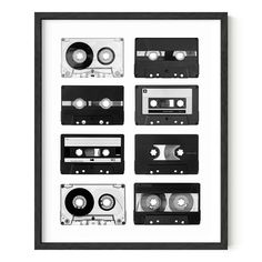 a black and white photo with cassettes on it, framed in a wooden frame