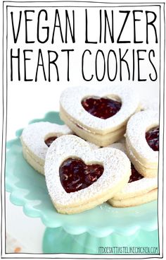 vegan linzer heart cookies on a blue plate