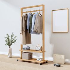 a wooden rack with clothes hanging on it