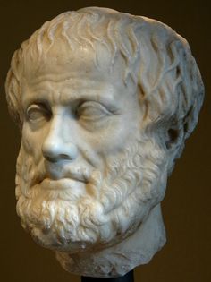 a white marble bust of a man with a beard