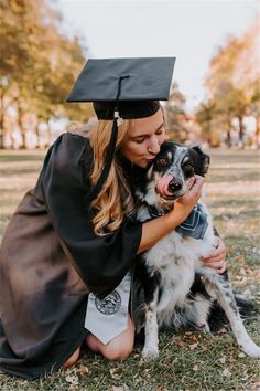 a woman in graduation cap and gown hugging her dog