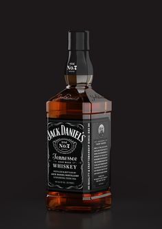 a bottle of jack daniels whiskey on a black background