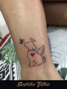 a dog with a heart tattoo on its leg