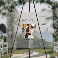 an easel with a wedding photo on it and the words written in cursive writing