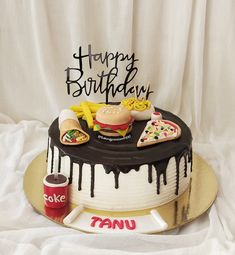 a birthday cake with toppings on it sitting on a table