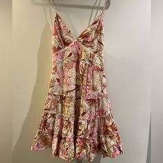 Nwt This Is Perfect For Summer With Its Flowy Floral Print! Size Us Medium 100% Rayon Has A Tie In The Back And A Zipper Closure Never Worn Pink Fitted Tiered Floral Dress, Pink Mini Floral Dress For Summer, Pink Floral Mini Dress For Brunch, Pink Tiered Mini Dress For Garden Party, Pink Sleeveless Floral Dress For Vacation, Pink Sundress For Party With Floral Design, Pink Mini Sundress For Summer, Pink Floral Mini Dress For Garden Party, Pink Sundress For Brunch