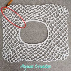 the crochet doily is being stitched together to make an applique