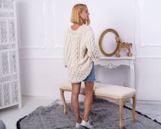 "MATERIAL : 3 strands of 100 % alpaca yarn COLOUR : Natural ( There may be a slight difference because of the different monitors' representation) ♥ In the picture the model is wearing a garment with these measurements : A: ( Body Length) : 28.7 \" / 73 cm B: (Chest width) : 22.8 \" / 58 cm C : (Sleeve from armpit) : 24.8 \" / 63 cm D: (Neck unrolled) : They are taken with the item laid flat and not streched. ♥ For choosing your size please look at size chart in our listing pictures. Please check Cream Chunky Knit Mohair Sweater, Cream Mohair Chunky Knit Sweater, Chunky Knit Alpaca Knitting Pattern For Fall, Fall Chunky Knit Alpaca Knitting Pattern, Cream Knitted Alpaca Sweater, Cozy Hand Knitted Beige Sweater, Oversized Hand-knitted Alpaca Sweater, Cozy Chunky Knit Alpaca Knitting Pattern, Cozy Hand-knitted Beige Sweater