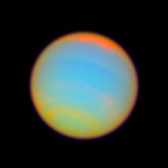 an orange and blue object in the dark sky