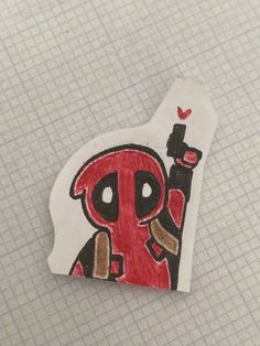 a piece of paper with a drawing of a deadpool on it