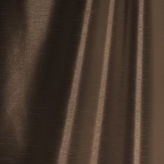 a close up view of a brown curtain with some lines on it and the fabric is very thin