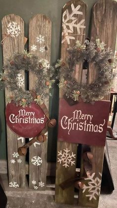 two wooden sleds decorated with christmas decorations