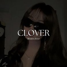 a woman wearing sunglasses with the words clover in front of her face and behind her head