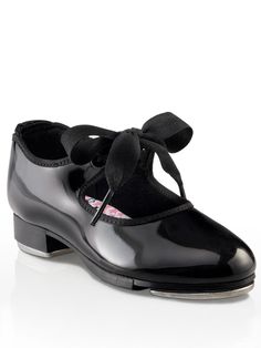 Jr. Tyette Tap Shoe - ChildThe Jr. Tyette tap shoe is the number one choice for a beginner tapper. Comes in shiny black patent leather, caramel PU leather or white PU leather. Adorable ribbon tie and star printed cotton lining will inspire your little dancer to have Broadway sized dreams. Features foam padded footbed, collar and Achilles notch for added comfort and security. Introductory tappers will take their first steps with confidence in the Jr. Tyette. Product Features: PVC (black patent) a Tap Dancer, Dance Sneakers, Heel Tap, Dance Accessories, Street Shoes, Patent Shoes, Tap Dance, Pointe Shoes, Ballet Girls