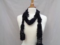 A black sparkly wild art scarf for darker accessorizing - great with silver and onyx jewelry! Hand knit in a lacy pattern in a mix of thick to thin, fluffy to smooth yarn with a hint of sparkle here and there .Such a cute accessory scarf, whether wrapped, tied, or worn as a necklace.  Hand knit right here at Girlpower Knits - where love, care and pride are knit into each piece! 2.53" wide x 70" long synthetic/natural blend Hand/machine wash, dry flat Girlpower Knits storefront - www.etsy.com/shop/Girlpower Women's Scarves www.etsy.com/shop/Girlpower?section_id=18989374 #5j Knit Fishnet, Wild Art, Art Scarves, Onyx Jewelry, Jewelry Hand, Teen Girls, Black Skinnies, Girl Power, Womens Scarves