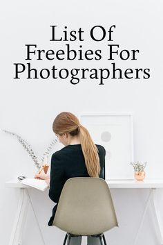 a woman sitting at a desk with a book in front of her and the words list of freebies for photographers