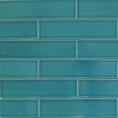 a close up view of a blue tile wall