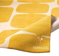 an area rug with yellow and white circles on it, which reads isrutgs