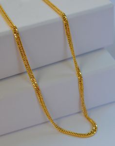 Elevate your everyday style with this exquisite dainty Kihei gold chain necklace, also known as a Japan chain. Crafted with precision, this delicate yet durable piece is perfect for adding a touch of sophistication to any outfit. -Material: 18 k Solid Gold -Necklace Length: 18" -       Chain Width: 2.7 mm PRODUCTION AND SHIPPING PROCESS -Ready to ship in 1-2 days. -Shipping through usps 1-5 days PERFECT GIFT -Your Jewelry comes in a lovely gift box. -If you are gifting this to a loved one, be sure to send us a message. A personal note would add a wonderful touch. Gold Plated Double Strand Figaro Chain Necklace, Double Strand Gold Plated Figaro Chain Necklace, Gold Double Strand Figaro Chain Necklace, Delicate Yellow Gold Figaro Chain Necklace, Delicate Gold Plated Figaro Chain Necklace, Delicate Gold-plated Figaro Chain Necklace, Delicate Gold Plated Chain Necklace, Delicate Yellow Gold Plated Chain Necklace, Long Yellow Gold Necklace With Figaro Chain