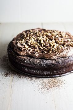 a chocolate cake sitting on top of a wooden table