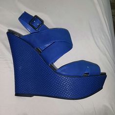 Royal Blue Brand New Never Worn Wedge Shoe Trendy Blue Wedge Sandals For Spring, Blue High Heel Wedge Sandals For Summer, Blue Platform Sandals With Closed Toe, Blue Platform Heels In Synthetic Material, Blue Closed Toe Platform Sandals, Blue Closed Toe Wedge Sandals For Summer, Blue Ankle Strap Wedge Sandals For Spring, Blue Closed Toe Wedge Sandals For Spring, Blue Closed-toe Wedge Sandals For Summer