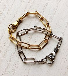 This bracelets are either real gold or silver plated iron links. The links are 7mm x 17mm. The gauge is a sturdy 14.0 (2mm). The hand grasping charm is a casted pewter with beautiful antiqued finished gold or silver. PLEASE READ: Please " size up" if you are in doubt to you wrist size. Many customers order these bracelets too small. I CAN exchange them if you send it back (your cost). However, you will need to purchase a return to you label from me. No cost for the re-sizing though. CARE TIPS: - Jewel Tone Decor, Hold On To Hope, 2023 School, Trending Jewelry, Rainbow Wall Hanging, Beading Jewelry, Metal Detecting, Hand Bracelet, Jewelry Hand