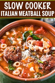 a bowl of slow cooker italian meatball soup with pasta and spinach in it