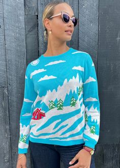 "This unique sweater encapsulates a winter wonderland chalet setting in a charming array of patterns and colors. Knitted in 100% cotton, this stylish sweater boasts full length sleeves, ribbed-knit detailing at the jewel neck, cuffs, and hemline. A statement in itself, this bold and intricately detailed jacquard knit sweater makes the perfect holiday sweater to wear yourself, gift to your stylish loved one, or both! Mid hip length 25\" from shoulder to bottom body edge. Made in USA from imported Cozy Fall Holiday Sweater, Winter Jacquard Knit Sweater, Winter Jacquard Knit Tops, Argyle Vest, Unique Sweater, Pulled Back Hairstyles, Stylish Sweater, Unique Sweaters, Stylish Sweaters