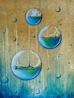 three bubbles that have been painted on the side of a wall with water droplets around them