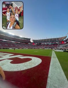 a woman taking a selfie at a football game