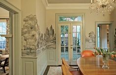 a dining room table and chairs in front of a door