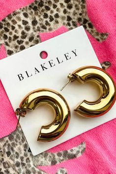 Make a statement with these stylish gold tube hoop earrings! MEASUREMENTS: .25" thick 1.25 hoop Trendy Gold-tone Metal Hoop Earrings, Trendy Gold-tone Small Hoop Earrings, Trendy Small Hoop Earrings In Gold-tone, Tube Hoop Earrings, Graphic Tee Dress, Color Analysis, Gold Hoop, Gold Hoop Earrings, Fashion Boutique