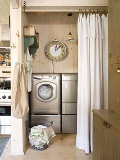 a kitchen with a washer and dryer in it