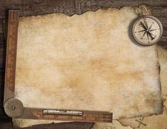 an old paper with a compass, ruler and other items on top of it stock photo