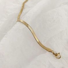 Minimal and classic gold herringbone bracelet. This dainty bracelet is your go to every-day jewelry. You can wear it alone or layer it with other gold bracelets. A perfect addition to your jewelry collection! ………………………………….D E T A I L S• Materials: Stainless steel, 18k gold plating.• Length: 6 inches (15.2 cm) + extension 1.5 inches (3 cm)• Width: 3 mm• This product is hypoallergenic, water and tarnish resistant Minimalist Gold-tone Chain Bracelet, Elegant Herringbone Necklace With Lobster Clasp, Elegant Gold Snake Chain Bracelet For Everyday, Minimalist Gold Bracelet With Lobster Clasp, Elegant Everyday Gold Snake Chain Bracelet, Elegant Gold Snake Chain Bracelet With Lobster Clasp, Gold Dainty Herringbone Necklace For Everyday, Elegant Gold Bracelet With Snake Chain, Elegant Gold Snake Chain Bracelets