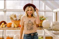 Celebrate your love of all things fall with this cute and comfy tee! Sure to make a statement, this adorable shirt will soon become your autumn favorite. Also makes a great gift for a friend! Comes in these gorgeous colors: -autumn orange -olive -soft cream ------Sizing and Fit------ Sizing measurements are included in a picture in the listing. -100% combed and ring spun cotton - 4.2 ounce t-shirt -Unisex jersey crewneck t-shirt - Shoulder taping  -Side seamed ------Processing and Shipping------ Cute Pre-shrunk Shirt For Fall, Cute Short Sleeve Fall Shirt, Cute Short Sleeve Shirt For Fall, Thankful Pumpkin, Thanksgiving Pumpkin, Retro Graphic Tees, Stacked Pumpkins, Flannel Jacket, Stocking Stuffer Gifts