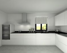 an empty kitchen with white cabinets and black counter tops is seen in this image from the front view