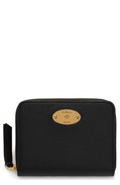 Simple and sophisticated, this compact wallet is crafted from heavily grained leather for luxe texture and polished with an oval branding plaque. 4.25"W x 3.5"H x .75"D Zip-around closure Dual interior compartments with center slip-pocket divider Interior slip pockets; four card slots Leather Imported Designer Handbags Classic Business Wallets With Gold-tone Logo Plaque, Leather Wallet With Gold-tone Logo Plaque, Elegant Everyday Wallets With Gold-tone Logo Plaque, Formal Leather Wallet With Gold-tone Logo, Classic Formal Coin Purse With Rfid Blocking, Elegant Bifold Wallet With Gold-tone Logo Plaque, Classic Formal Wallet With Logo Plaque, Classic Formal Wallets With Logo Plaque, Elegant Bifold Wallet With Logo Plaque